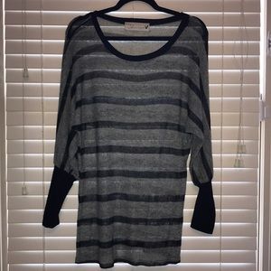 grey and black stripped sweater shirt